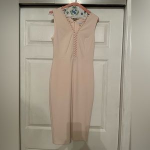 Mid length blush pink body con Calvin Klein dress